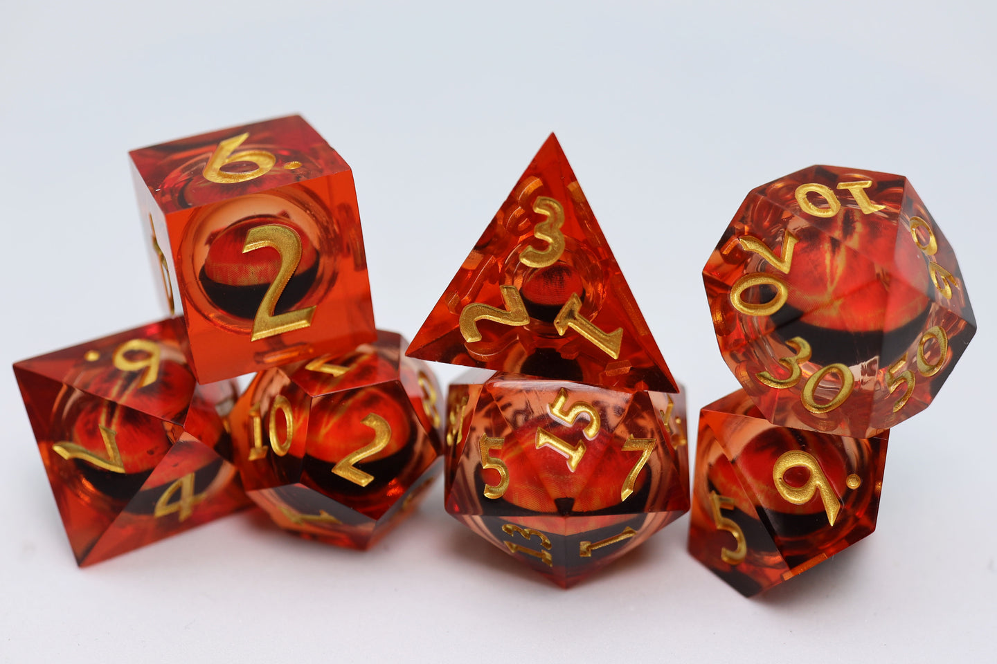 Sharp Edge Moving Eye RPG Dice Set - Amber Cyclops | GrognardGamesBatavia