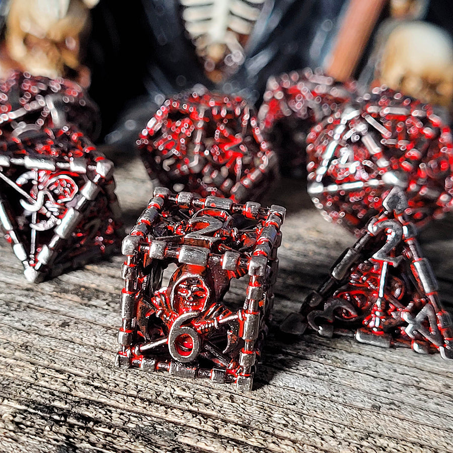 Reaper's Confine Silver Red Hollow Metal RPG Dice Set | GrognardGamesBatavia