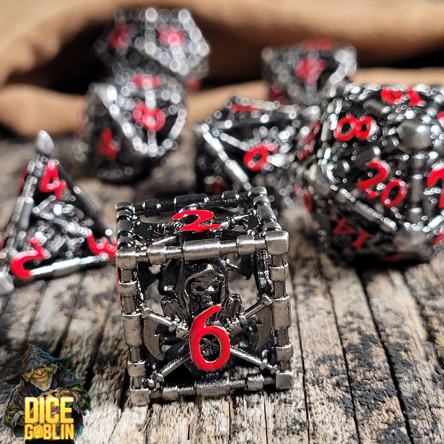 Dice Goblin Reaper's Confine Hollow Metal RPG Dice Set - Silver with Red | GrognardGamesBatavia