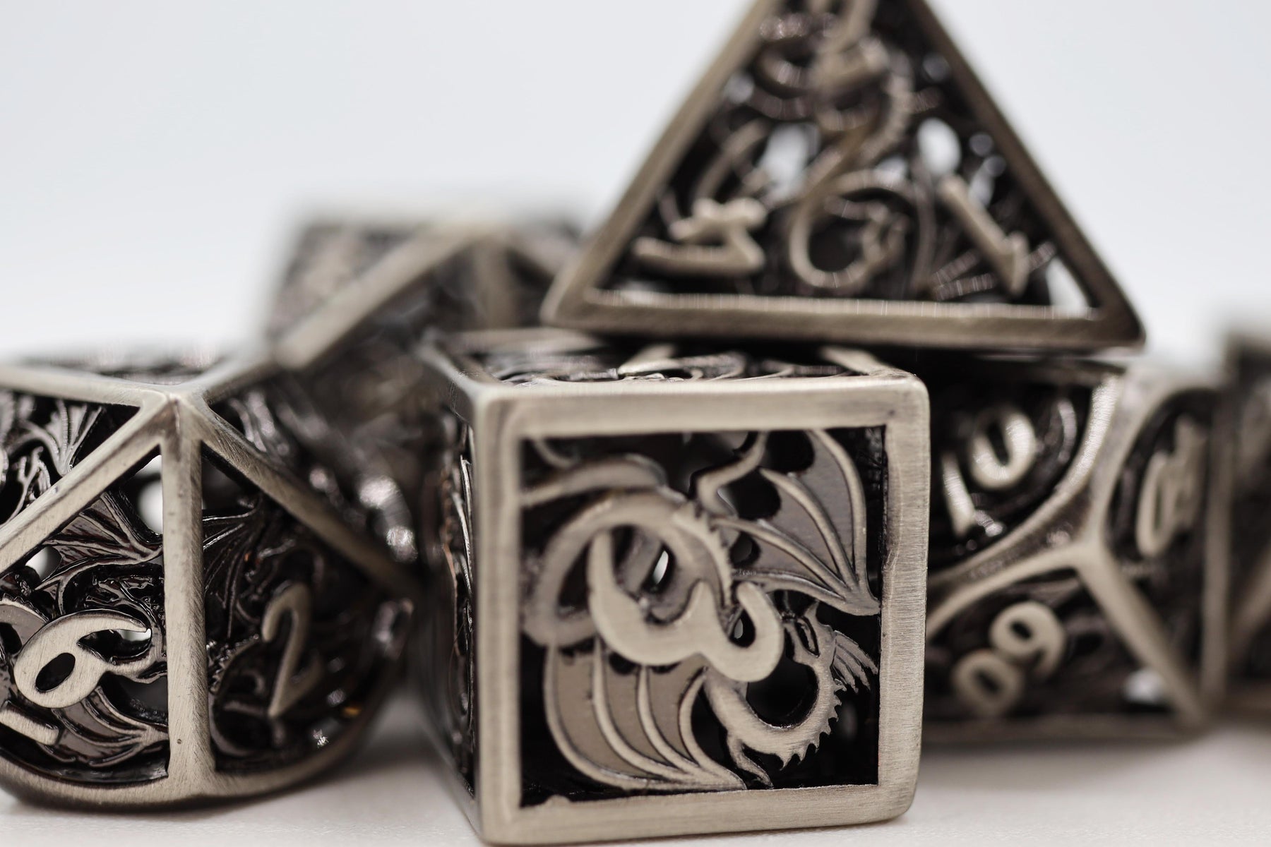 Hollow Silver Dragon RPG Metal Dice Set | GrognardGamesBatavia